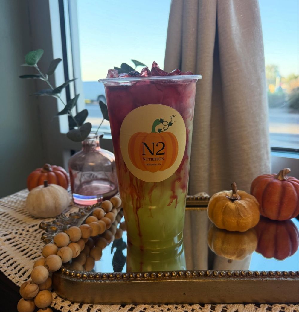 Fall N2 tea in a pumpkin-sticker cup