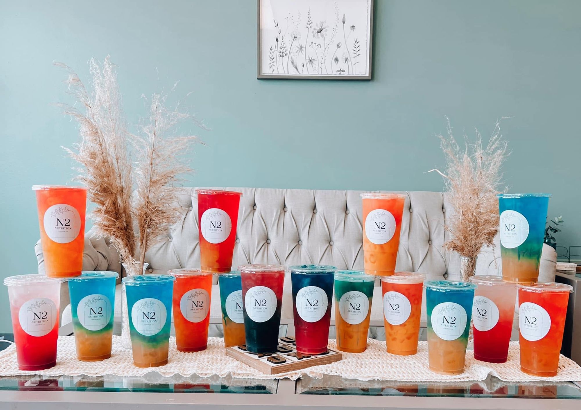 A lineup of colorful N2 Nutrition loaded teas on a table