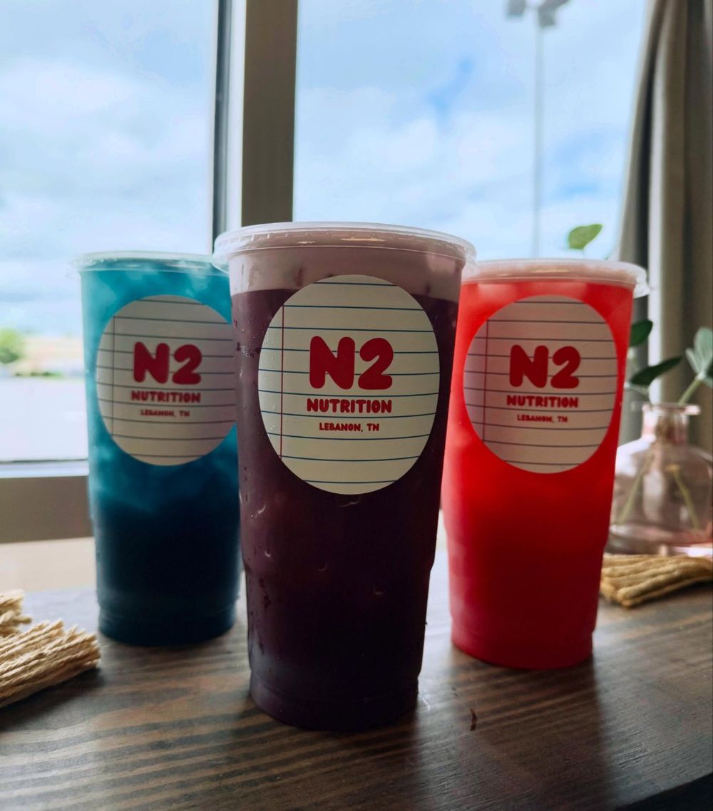 Three N2 teas lined up by the window